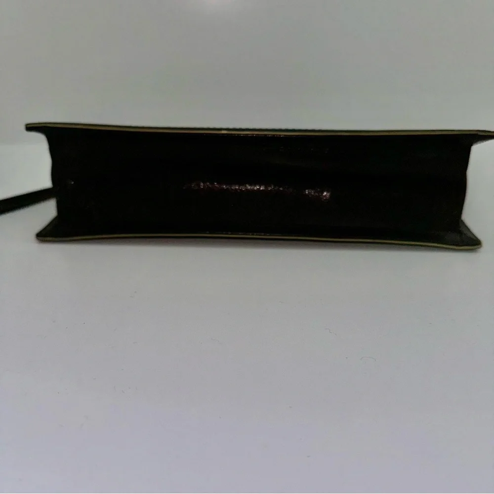 Ellen Tracy Black Leather Clutch with red logo interior.